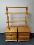 A pair of contemporary pine two drawer bedside chests together with a pine towel rail