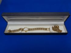 A lady's gold plated wristwatch with matching bracelet