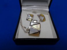 A set of matching pendant on chain with earrings in silver