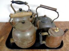 A tray containing four 19th century and later antique copper kettles