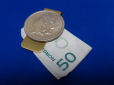 An American 1890 silver dollar money clip