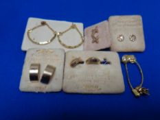 Six pairs of gold plated earrings