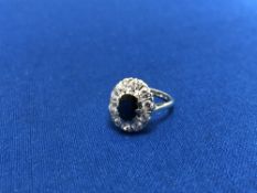 A 9ct gold blue sapphire cluster ring