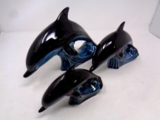 A graduated set of three Poole dolphins