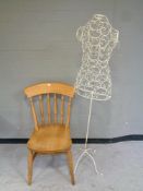 A pine kitchen chair together with a wire metal mannequin on stand