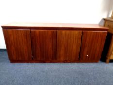 A 20th century nine piece Skovby dining room suite comprising of double door bookcase fitted