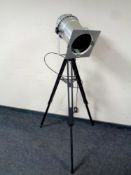 An industrial style floor lamp on tripod base
