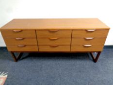 A mid 20th century Europa Furniture nine drawer chest