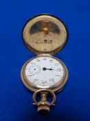A vintage lady's gold plated fob watch