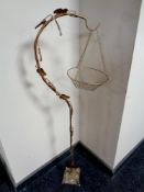 An antique brass Art Nouveau bird cage stand with basket