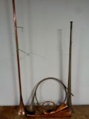 A box of assorted copper hunting horns