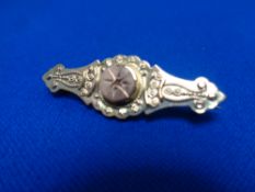 A 9ct gold diamond set brooch