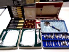 A tray containing two boxed Oneida cranberry dishes with servers,