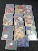 A box containing eleven plastic storage boxes containing crafting stamps