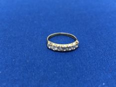 A 9ct gold half eternity ring