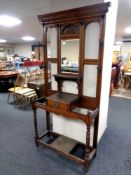 A late 19th century carved oak mirrored hall stand