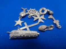 Nine silver charms