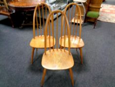 A set of three Ercol solid elm and beech high backed dining chairs (as found)