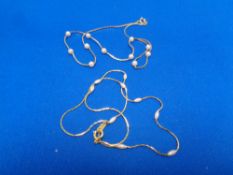 Two continental faux pearl necklaces