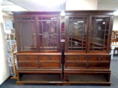 A pair of 19th century glazed mahogany bookcases fitted fall front cupboard beneath