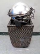A contemporary ball electric garden water feature