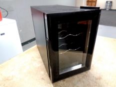 A bench top mini wine fridge