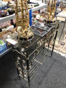 A wrought iron glass topped hall table,