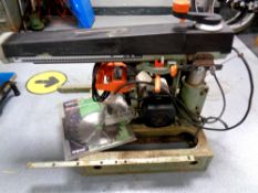 A DeWalt De 1251 electric table saw with replacement blades