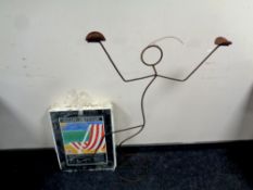 Three frameless clip frames together with a floor standing candle holder modelled as a figure