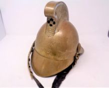 A vintage brass fireman's helmet,