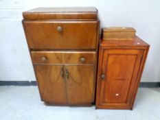 A 20th century walnut cocktail cabinet together with an oak pot cupboard and a trinket box