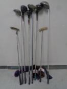 Seven assorted golfing drivers and putters to include three Calloway Big Berthas