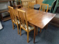 A 20th century teak G-plan dining table, length 153 cm with four Morris of Glasgow rail back chairs
