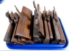 A tray containing a quantity of vintage moulding planes