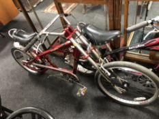 An Schwinn Stingray bike in the form of a chopper, red.