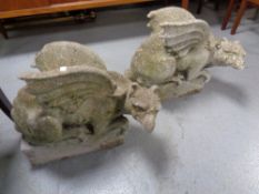 Two concrete garden figures of dragons
