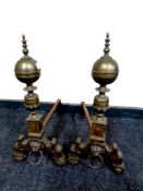 A pair of 19th century lion mask brass fire dogs,