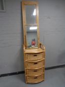 A bamboo and wicker five drawer bathroom chest,