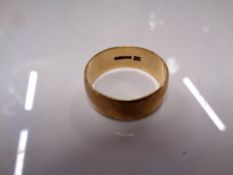 A gentleman's 9ct gold wedding band, 3.9g.