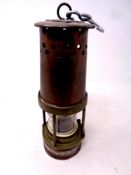 A 20th century copper and brass Davis 2BA miner's lamp