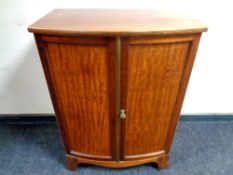 A 19th century inlaid double door cabinet, width 63.