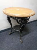 A circular bar table on a cast iron Britannia base