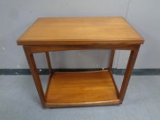 A 20th century teak turn over top tea trolley