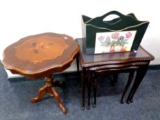 A nest of three glass topped tables,