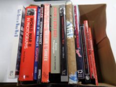 A box of hard back and soft back books relating to WWII
