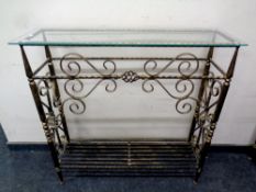 A wrought iron glass topped hall table,