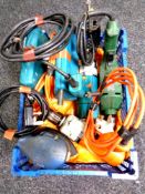 A basket containing power tools to include drills,