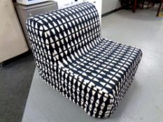 A contemporary folding bed chair