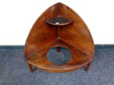 An early 19th century mahogany corner wash stand,