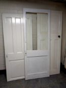 Three early 20th century painted interior doors,